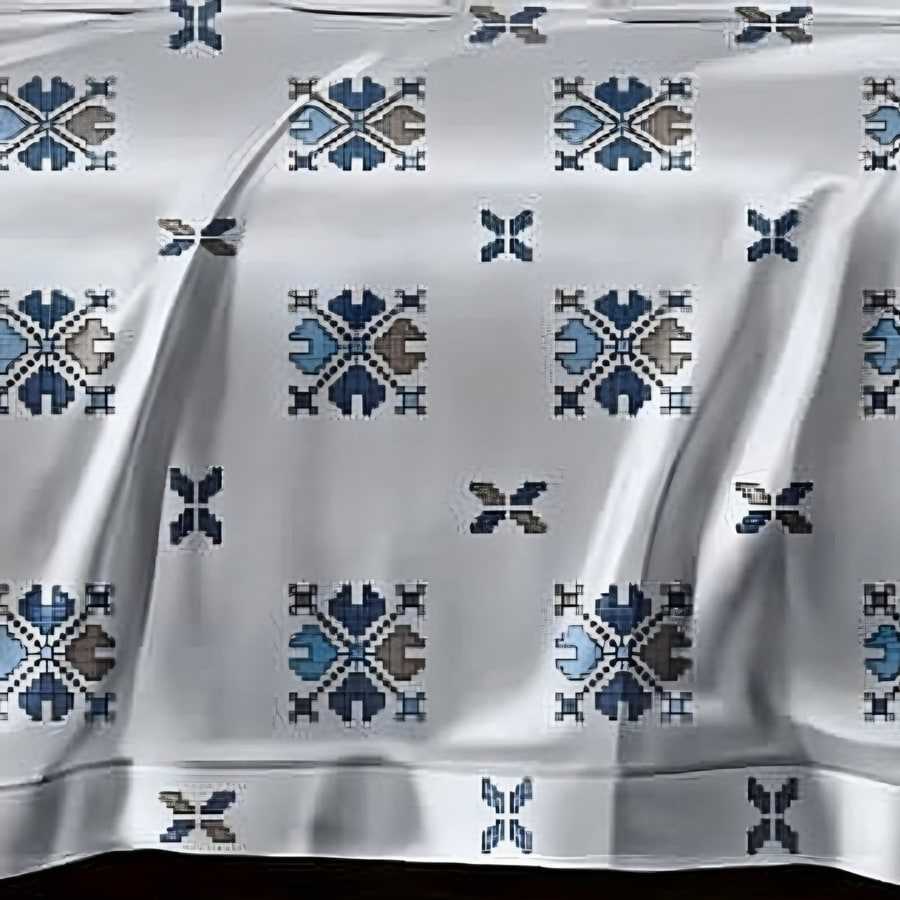 Close-up of the cross-stitch motif print in Navy on silver grey (AN-08)