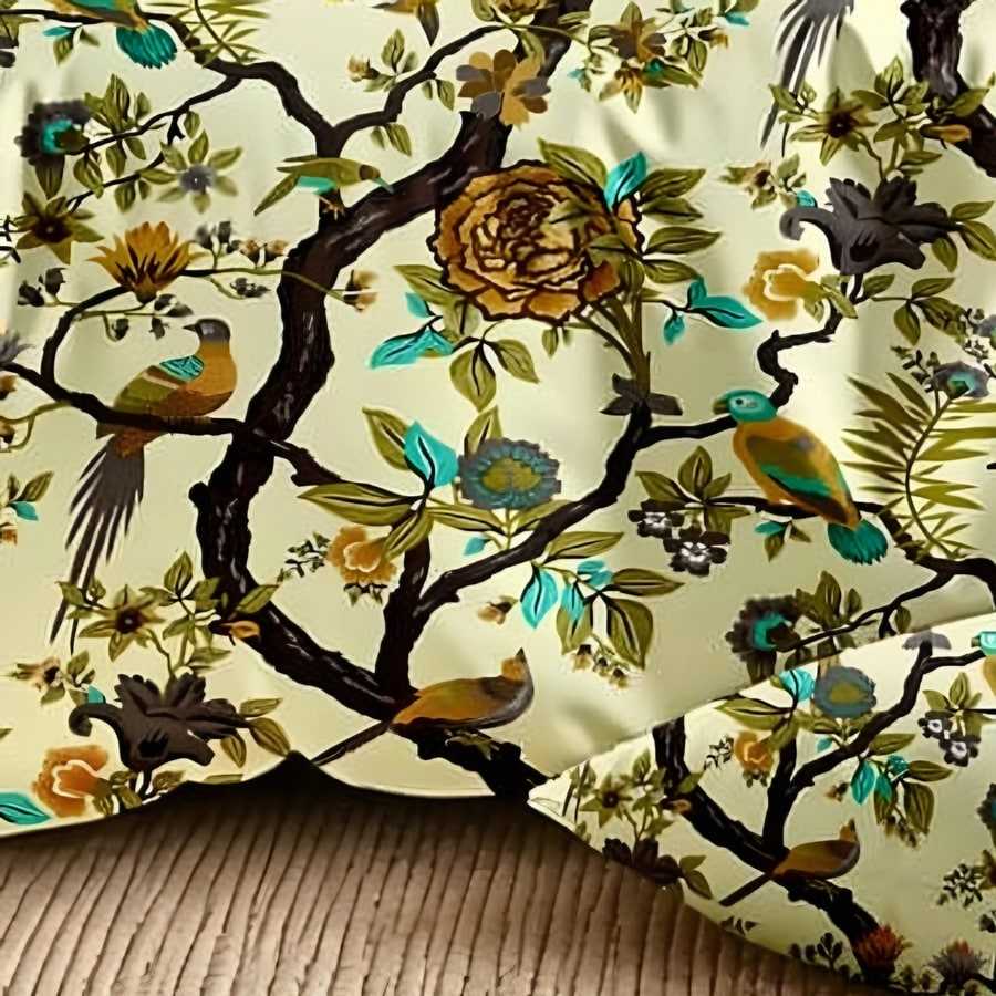Close-up of the tree-of-life bird and vine print in Olive & gold on lemon (DH-06)