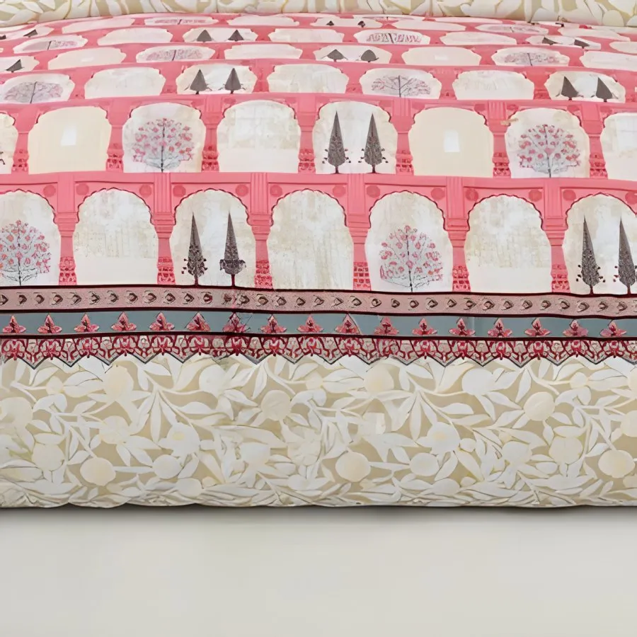 Close-up of arches and little trees with a fine gold print on coral cotton (Gold Print Arch Garden)