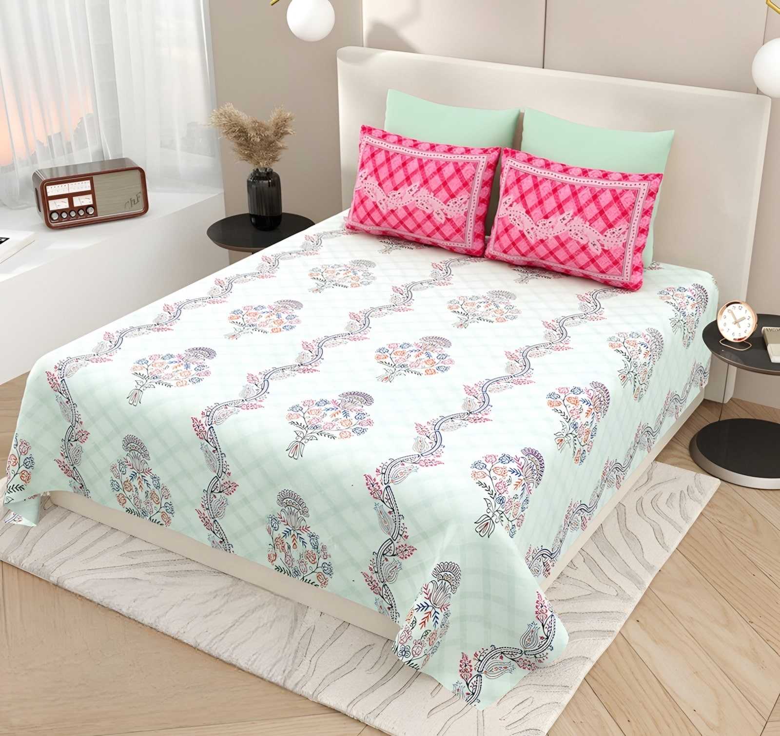 Kashida Floral Wave Cotton Bedsheet Set in Mint & pink (KS-03) on a made bed