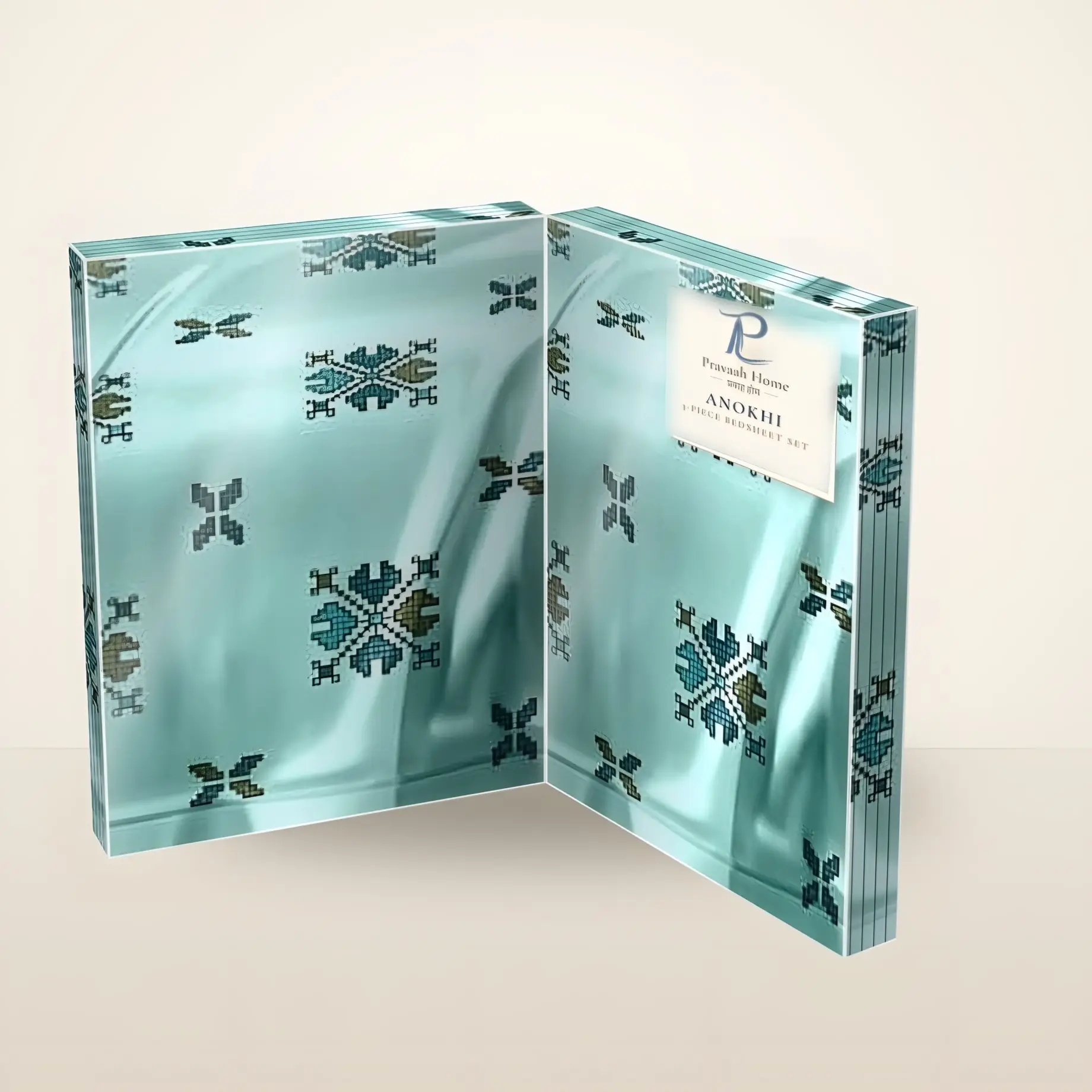 Anokhi cross-stitch bedsheet set in book-fold gift packaging, opened to show the print (illustration)