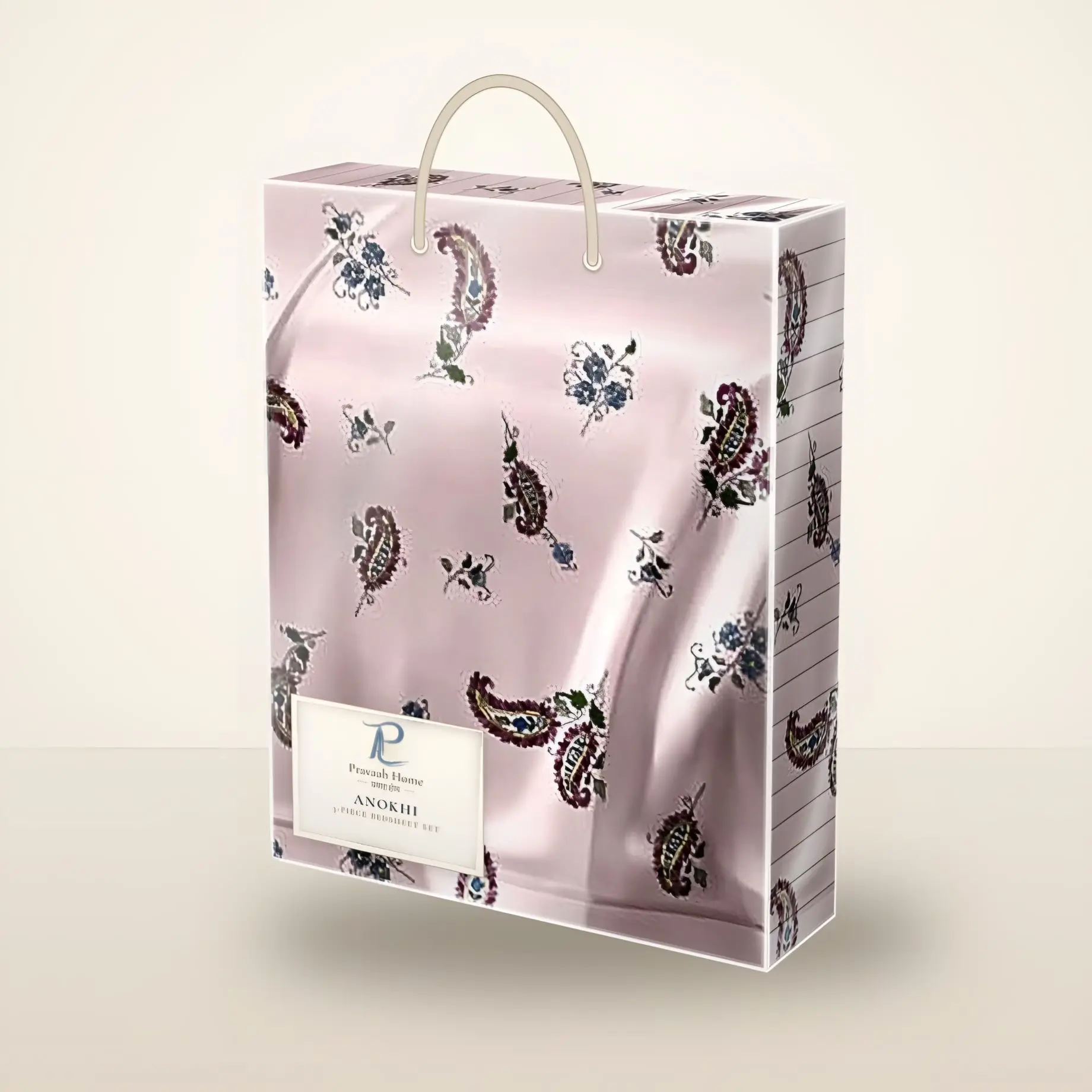 Anokhi paisley buti bedsheet set packed in a clear gift box with a rope handle (illustration)