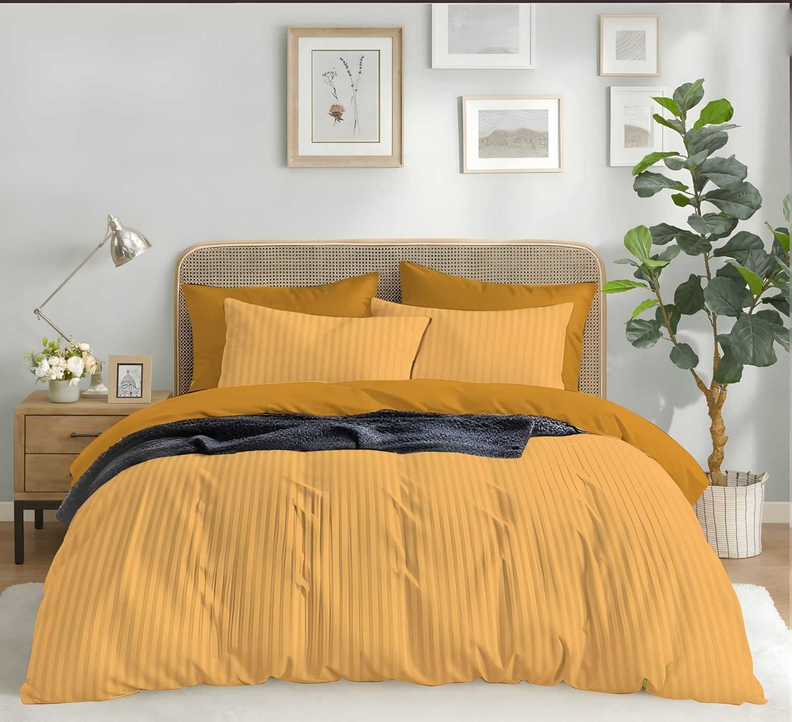 Satin stripe bedsheet set in Yellow (ST-13) on a made bed in a bright bedroom