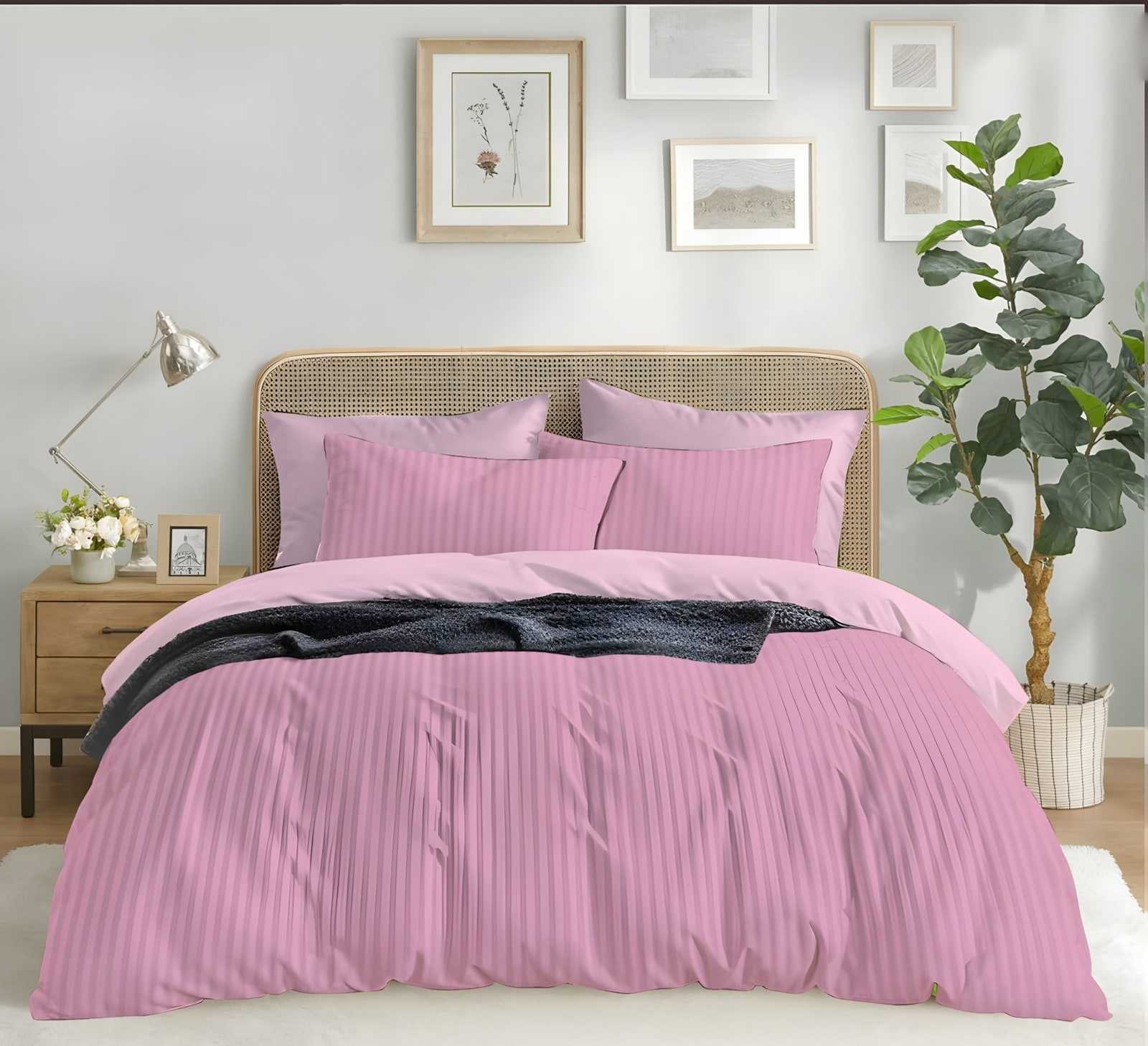Satin stripe bedsheet set in Pink (ST-16) on a made bed in a bright bedroom